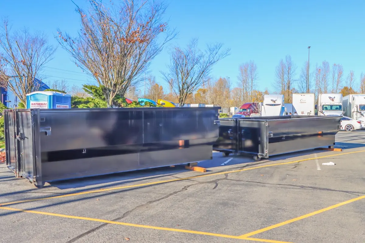 Professional dumpster rental service with roll-off container on residential driveway in Maidencreek